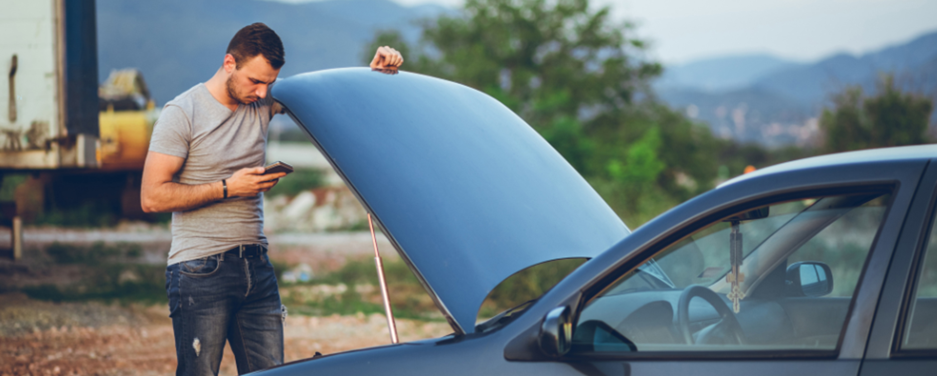 A guy with a broked down car